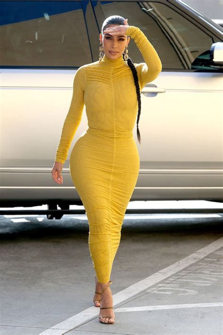 Kim Kardashian’s Tight Yellow Dress, Long Braid & Hoops – Pics – Hollywood Life
